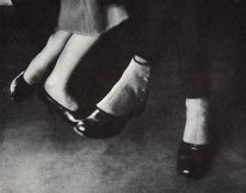 Feet of passengers on the New York subway, USA, early 1930s