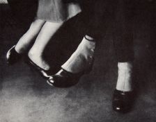 Feet of passengers on the New York subway, USA, early 1930s. Creator: Unknown