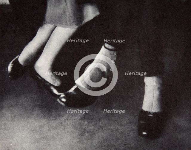 Feet of passengers on the New York subway, USA, early 1930s. Creator: Unknown.