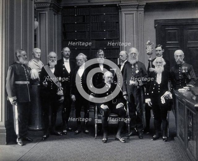 Fellows of the Royal Society: Sir John Evans, bust of Sir Isaac Newton, Lord Kelvin, RB Clifton... Creator: Mayall.