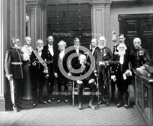 Fellows of the Royal Society: Sir John Evans, bust of Sir Isaac Newton, Lord Kelvin, RB Clifton... Creator: Mayall.