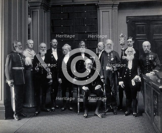 Fellows of the Royal Society: Sir John Evans, bust of Sir Isaac Newton, Lord Kelvin, RB Clifton... Creator: Mayall.