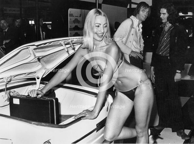 Female model in bikini at 1976 Motor Show, Earl's Court. Creator: Unknown.
