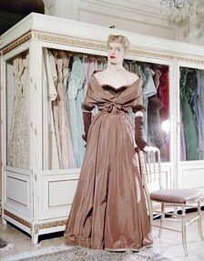 Female model shows an evening dress, Stockholm, 1950s. Artist: Göran Algård