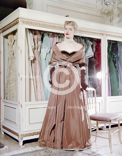 Female model shows an evening dress, Stockholm, 1950s. Artist: Göran Algård