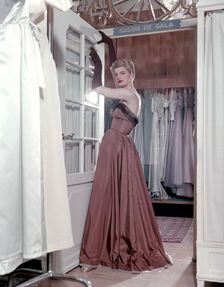 Female model shows an evening dress, Stockholm, 1950s. Creator: Göran Algård