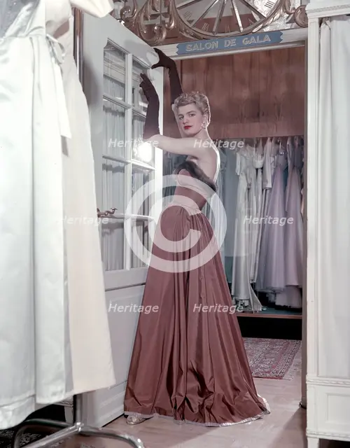 Female model shows an evening dress, Stockholm, 1950s. Creator: Göran Algård.
