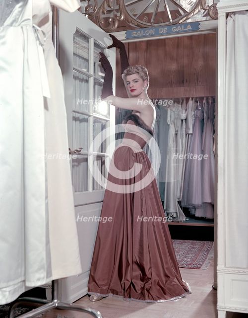 Female model shows an evening dress, Stockholm, 1950s. Creator: Göran Algård.