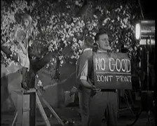 Female Actor Sitting in a Blossom Tree Whilst a Male Civilian Talks to Her..., 1920s. Creator: British Pathe Ltd