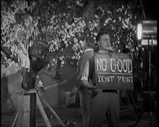 Female Actor Sitting in a Blossom Tree Whilst a Male Civilian Talks to Her..., 1920s. Creator: British Pathe Ltd