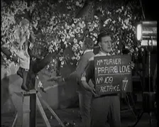 Female Actor Sitting in a Blossom Tree Whilst a Male Civilian Talks to Her..., 1920s. Creator: British Pathe Ltd