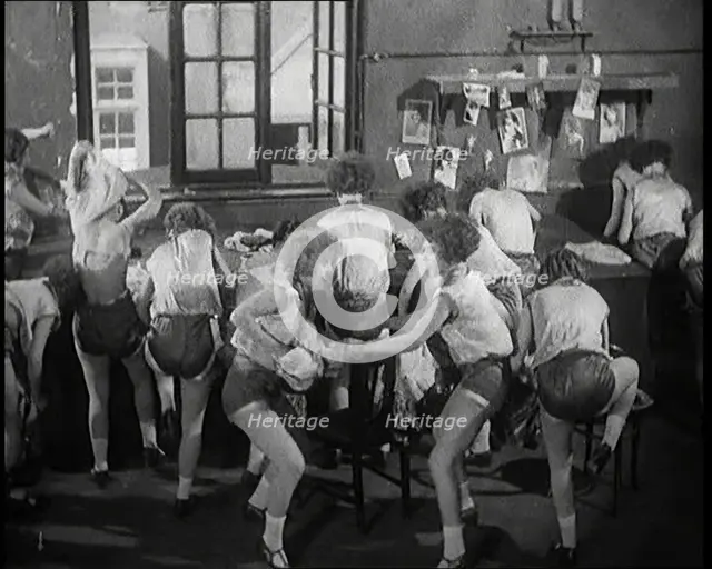 Female Actors Rapidly Changing Costumes For the Next Scene Backstage at the Theatre, 1920s. Creator: British Pathe Ltd.