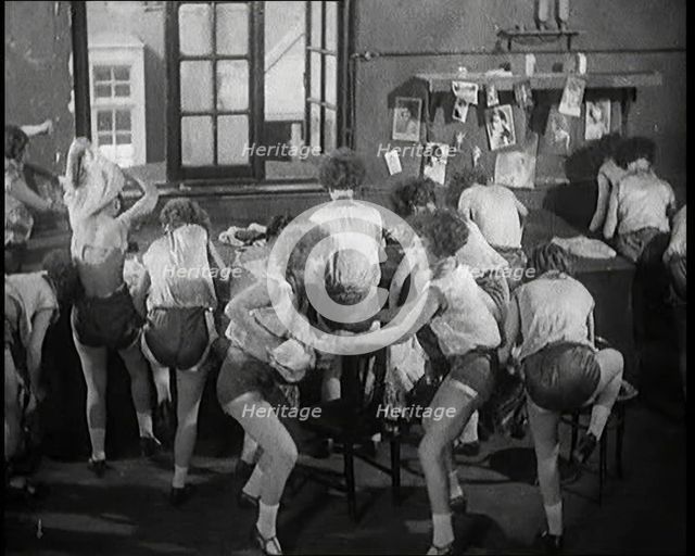 Female Actors Rapidly Changing Costumes For the Next Scene Backstage at the Theatre, 1920s. Creator: British Pathe Ltd.