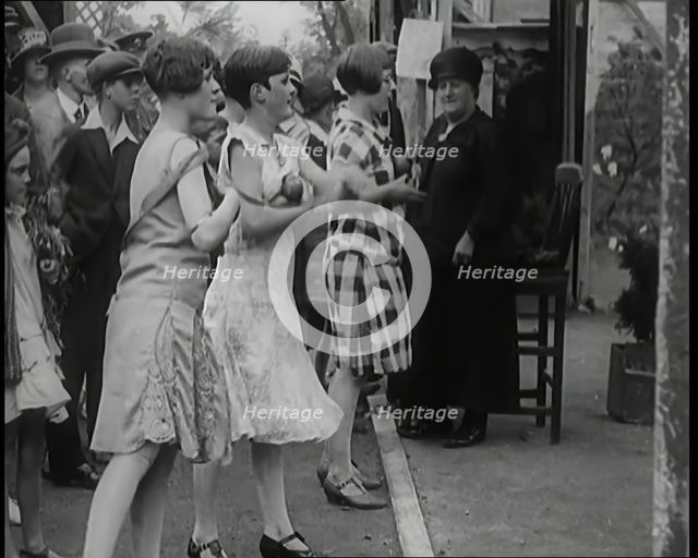 Female Children Throwing Balls at a Coconut Shy, 1926. Creator: British Pathe Ltd.