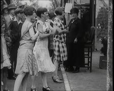 Female Children Throwing Balls at a Coconut Shy, 1926. Creator: British Pathe Ltd