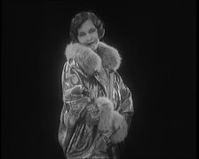 Female Civilian Modelling a Glamorous Fur Trimmed Coat, 1920. Creator: British Pathe Ltd