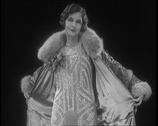 Female Civilian Modelling a Glamorous Fur Trimmed Coat, 1920. Creator: British Pathe Ltd