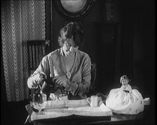 Female Civilian Seating at a Table Serving Tea, 1920. Creator: British Pathe Ltd