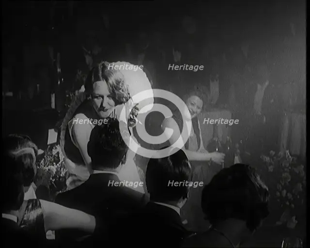 Female Civilian Singing in a Nightclub. She Walks Towards a Male Civilian and Dances in..., 1924. Creator: British Pathe Ltd.