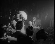 Female Civilian Singing in a Nightclub. She Walks Towards a Male Civilian and Dances in..., 1924. Creator: British Pathe Ltd