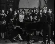 Female Civilian Singing Scales Badly Whilst Other Female Civilian is Playing the Piano in..., 1920s. Creator: British Pathe Ltd