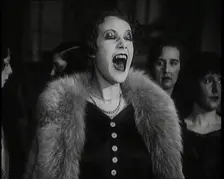 Female Civilian Singing Scales Badly Whilst Other Female Civilian is Playing the Piano in..., 1920s. Creator: British Pathe Ltd