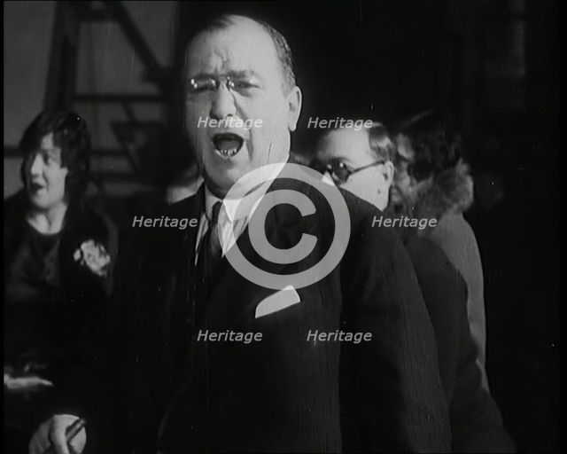 Female Civilian Singing Scales Badly Whilst Other Female Civilian is Playing the Piano in..., 1920s. Creator: British Pathe Ltd.