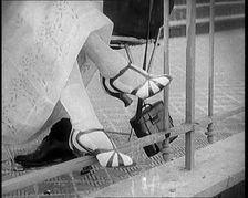 Female Civilian Wearing a Smart Heeled Pair of Shoes in Stripes, 1920. Creator: British Pathe Ltd