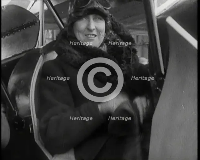 Female Civilian Wearing an Aviator's Hat Onboard of an Airplane, 1927. Creator: British Pathe Ltd.