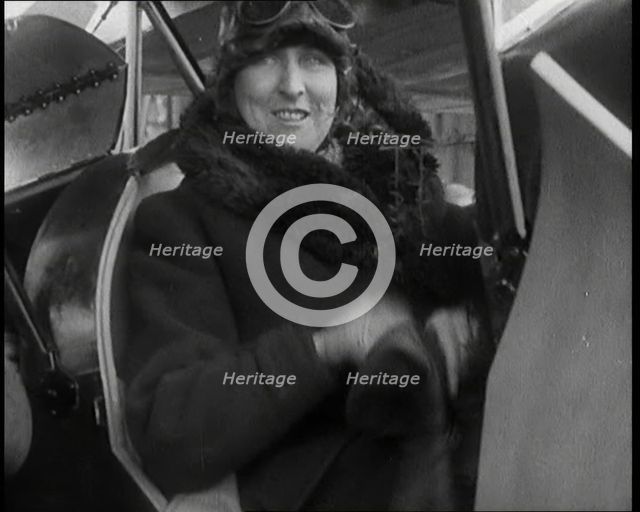 Female Civilian Wearing an Aviator's Hat Onboard of an Airplane, 1927. Creator: British Pathe Ltd.