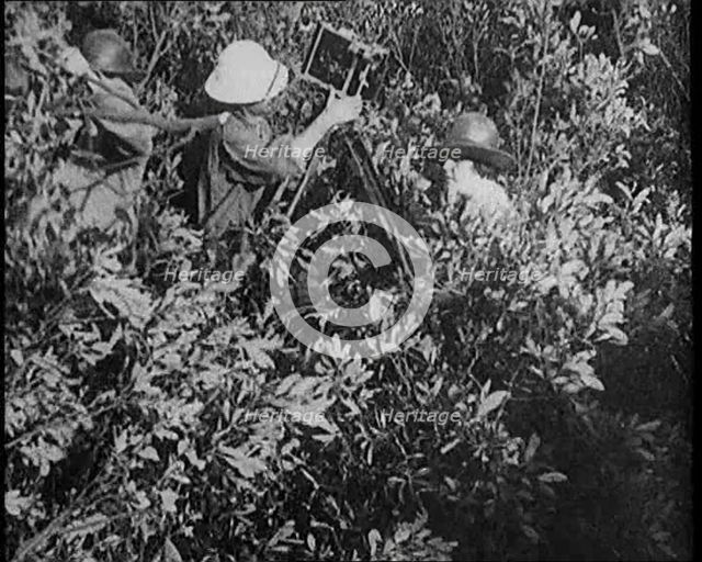 Female Civilians Wearing Explorers Outfit Setting up a Camera to Record Nature Life in the..., 1920. Creator: British Pathe Ltd.