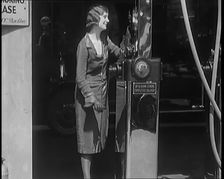 Female Civilians Working Petrol Pumps in a Garage, 1931. Creator: British Pathe Ltd