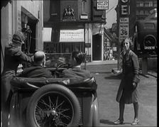 Female Civilians Working Petrol Pumps in a Garage and Filling up a Car, 1931. Creator: British Pathe Ltd