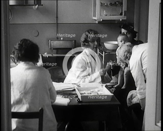 Female Civilians and Their Babies at Health Clinics Where the Babies Are Checked by Female..., 1931. Creator: British Pathe Ltd.