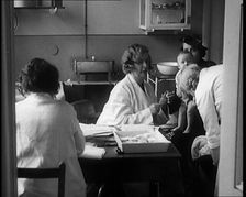 Female Civilians and Their Babies at Health Clinics Where the Babies Are Checked by Female..., 1931. Creator: British Pathe Ltd