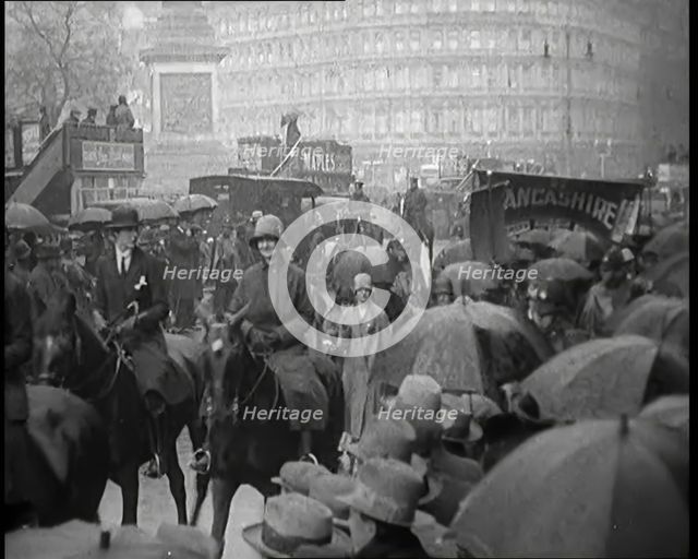 Female Civilians on Horseback Demonstrating in London Against Continuous Strikes in the Rain, 1926. Creator: British Pathe Ltd.