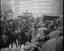 Female Civilians on Horseback Demonstrating in London Against Continuous Strikes in the Rain, 1926. Creator: British Pathe Ltd