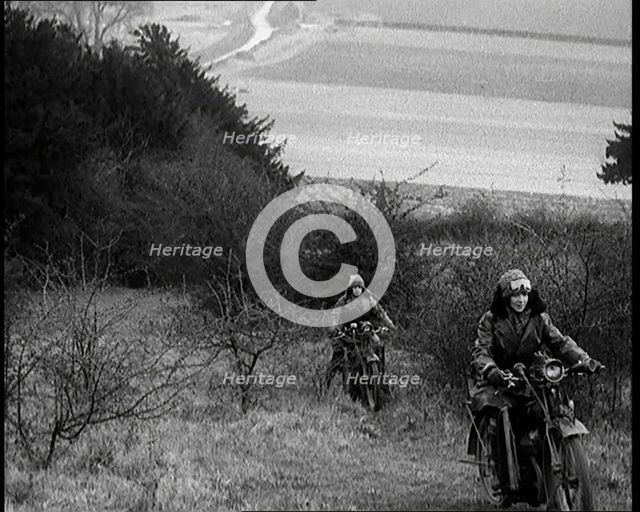 Female Civilians Riding Motorcycles on an Uphill Climb, 1931. Creator: British Pathe Ltd.