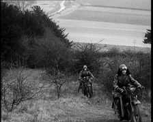 Female Civilians Riding Motorcycles on an Uphill Climb, 1931. Creator: British Pathe Ltd