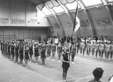 Female gymnasts parade in a gymnasium, Swedish National Day, Trelleborg, Sweden, 1969