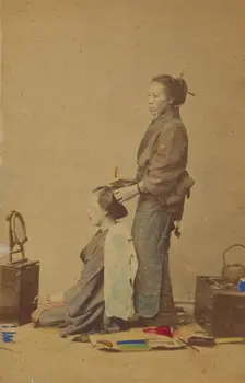 Female hair dresser, 1870-1880. Creator: Unknown