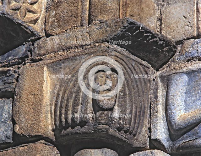  'Female Head', capital of the façade of the church of San Luis de Alos d'Aneu.