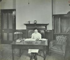 Female student sitting at desk, Shoreditch Technical Institute, London, 1907