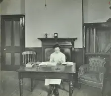 Female student sitting at desk, Shoreditch Technical Institute, London, 1907
