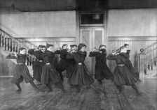 Female students exercising with dumbbells, Western High School, Washington, D.C., (1899?). Creator: Frances Benjamin Johnston