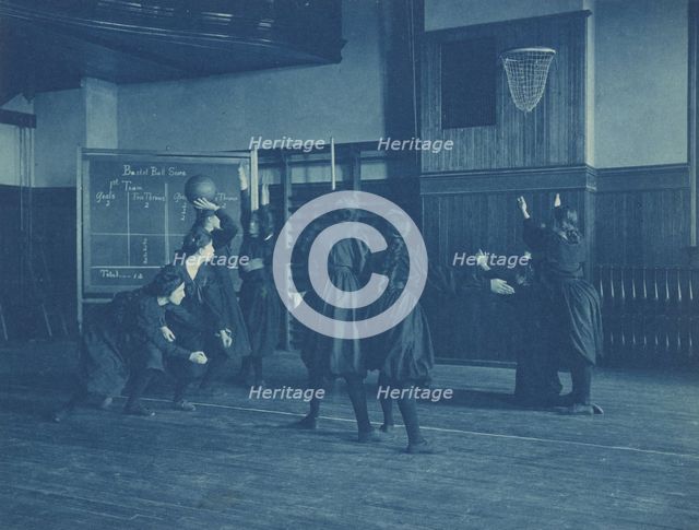 Female students playing basketball, Western High School, Washington, D.C., (1899?). Creator: Frances Benjamin Johnston.