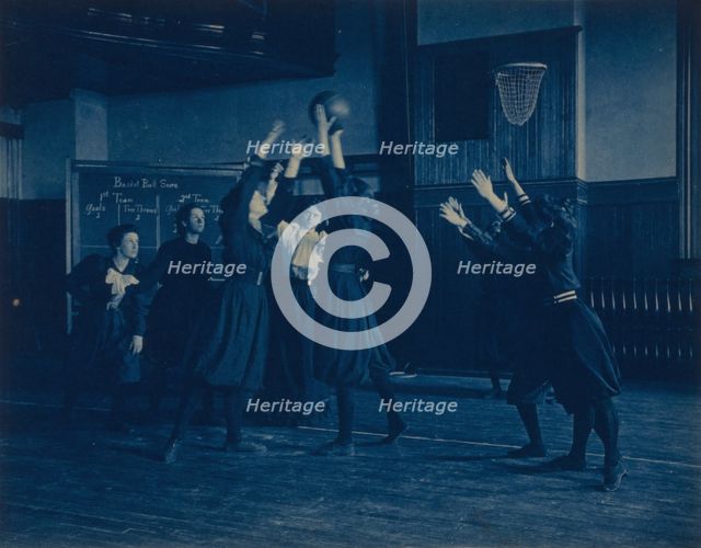 Female students playing basketball in a gymnasium, Western High School, Washington, D.C., (1899?). Creator: Frances Benjamin Johnston.