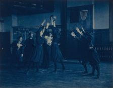 Female students playing basketball in a gymnasium, Western High School, Washington, D.C., (1899?). Creator: Frances Benjamin Johnston