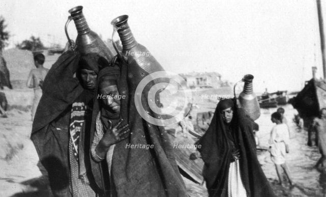 Female water carriers, Amarah, Iraq, 1917-1919. Artist: Unknown