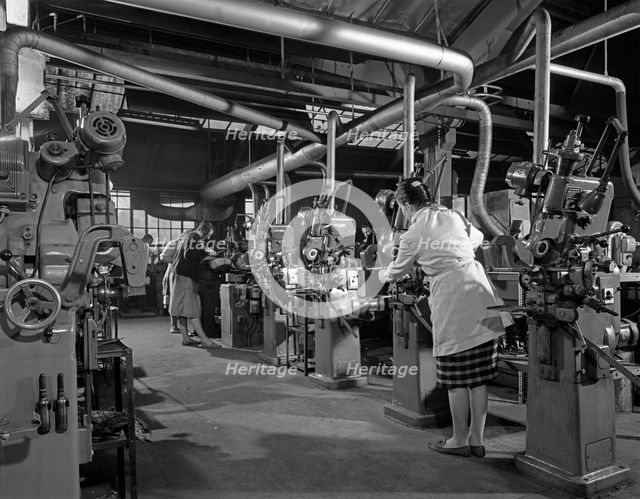 Female workers sharpening saw blades, Sheffield, South Yorkshire, 1963. Creator: Michael Walters.
